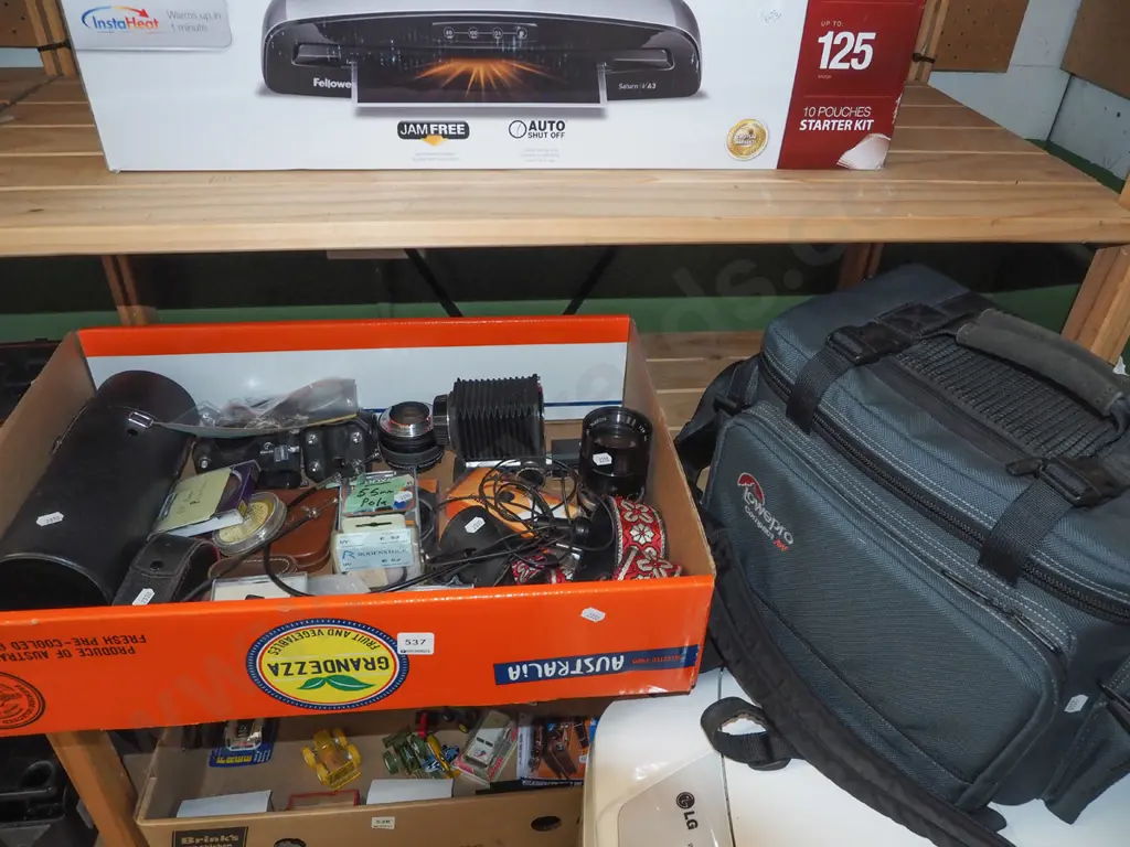 box; Minolta bellows, SLR lenses and accessories, filters, Lowepro camera bag etc. Image 1++