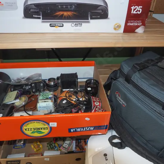 box; Minolta bellows, SLR lenses and accessories, filters, Lowepro camera bag etc.