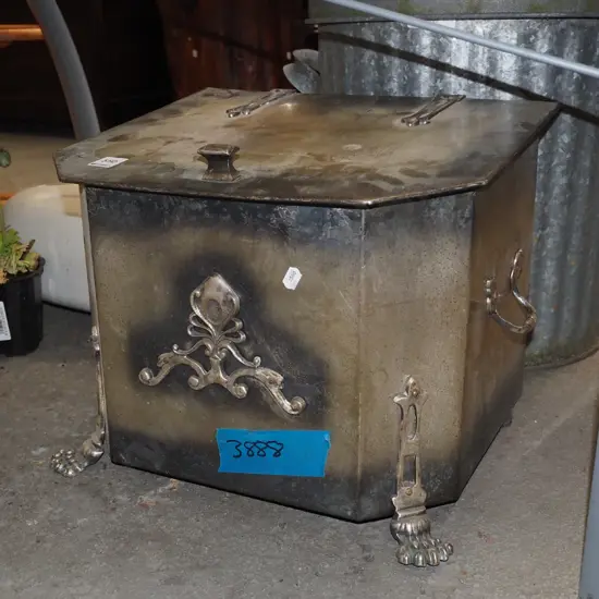 ornate metal coal bin