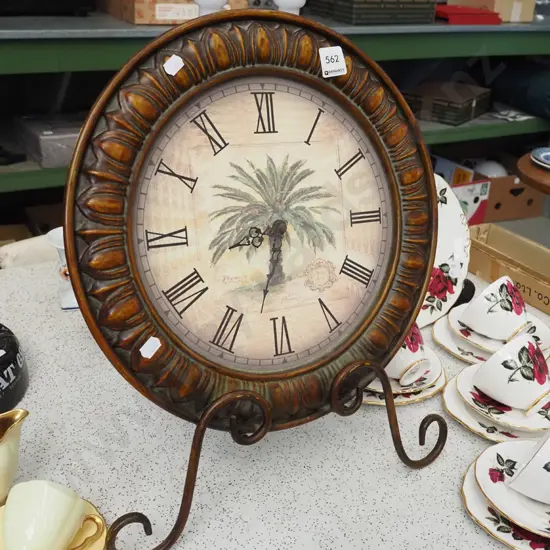 pressed metal framed wall clock on metal stand