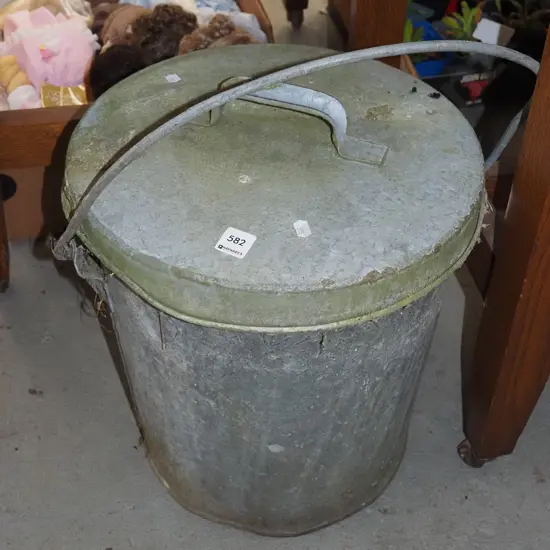 galvanised lidded ash can