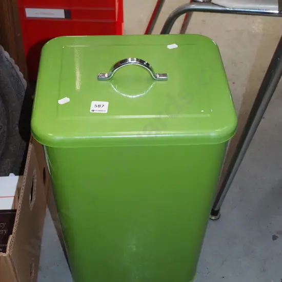 green metal lidded rubbish bin