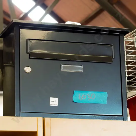 black metal letterbox - key in office