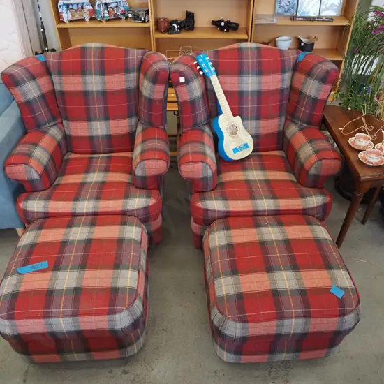 pair of tartan checked wingback armchairs with matching footstools