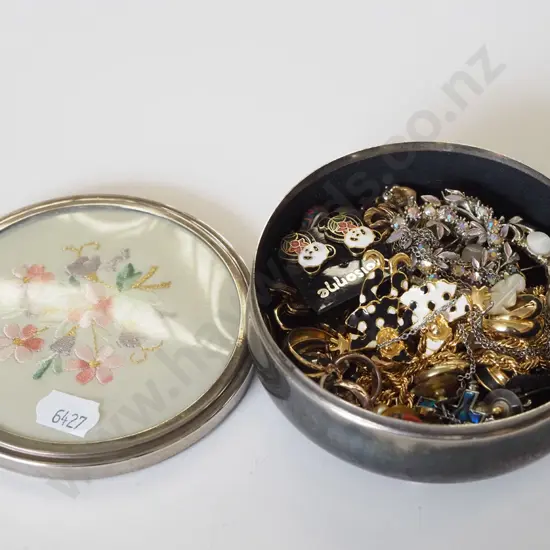 small tin of costume jewellery