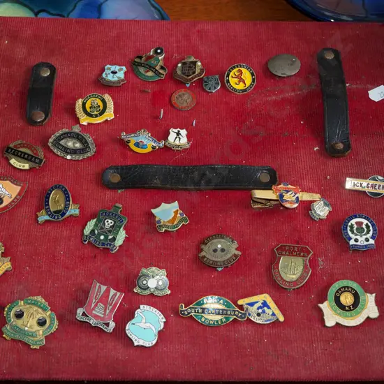 board with bowling club badges