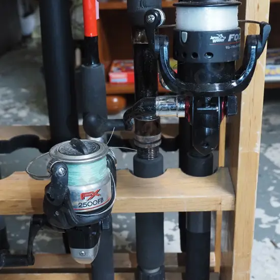 3x fishing rods - 2 with reels - blue dots