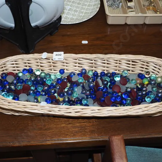 cane basket and marbles