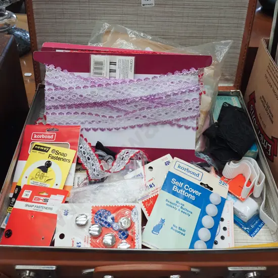 small vintage suitcase; ribbons, buttons etc