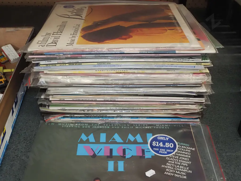 stack of LPs; Miami Vice sound track, Crystal Gale etc Image 1++