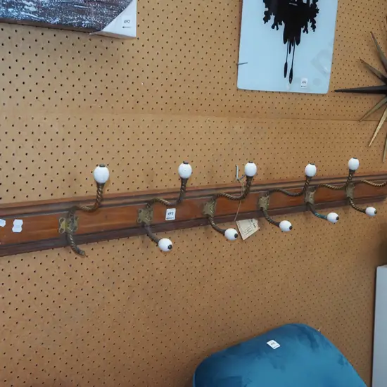 6x coat hooks on board - 1 has damage