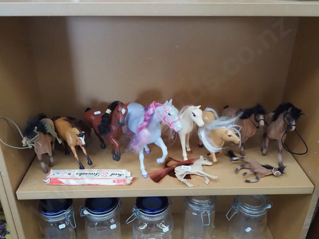 shelf of toy horses Image 1++