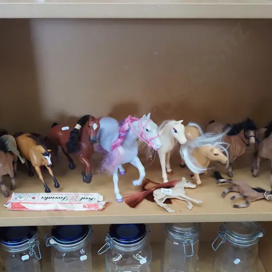 shelf of toy horses