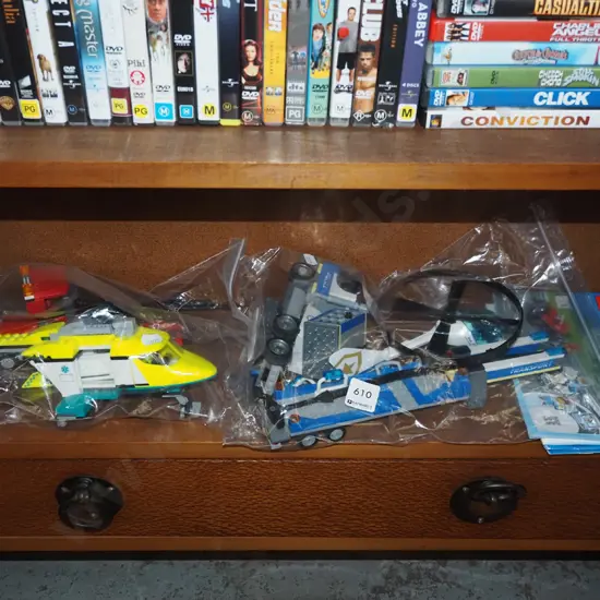 various Lego vehicles in plastic bags