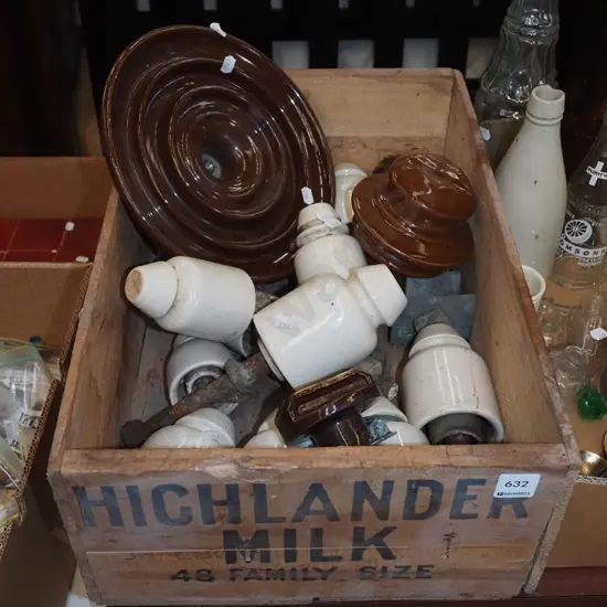 wooden Highlander milk crate, various electric insulators