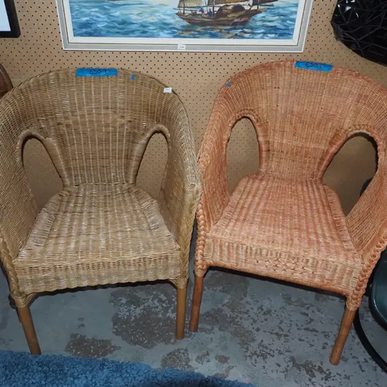 2x woven cane armchairs - 1 has jnafdkhoi;d