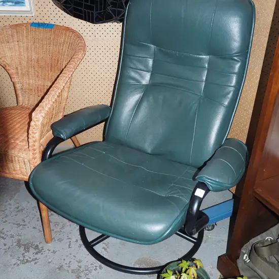 green vinyl swivel armchair