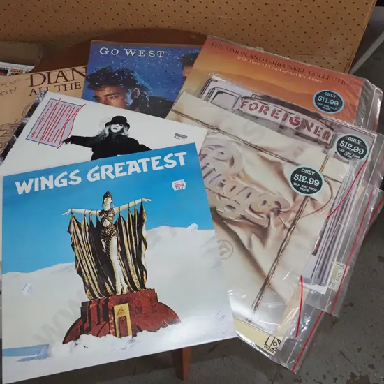 stack of LPs; Wings, Stevie Nicks etc