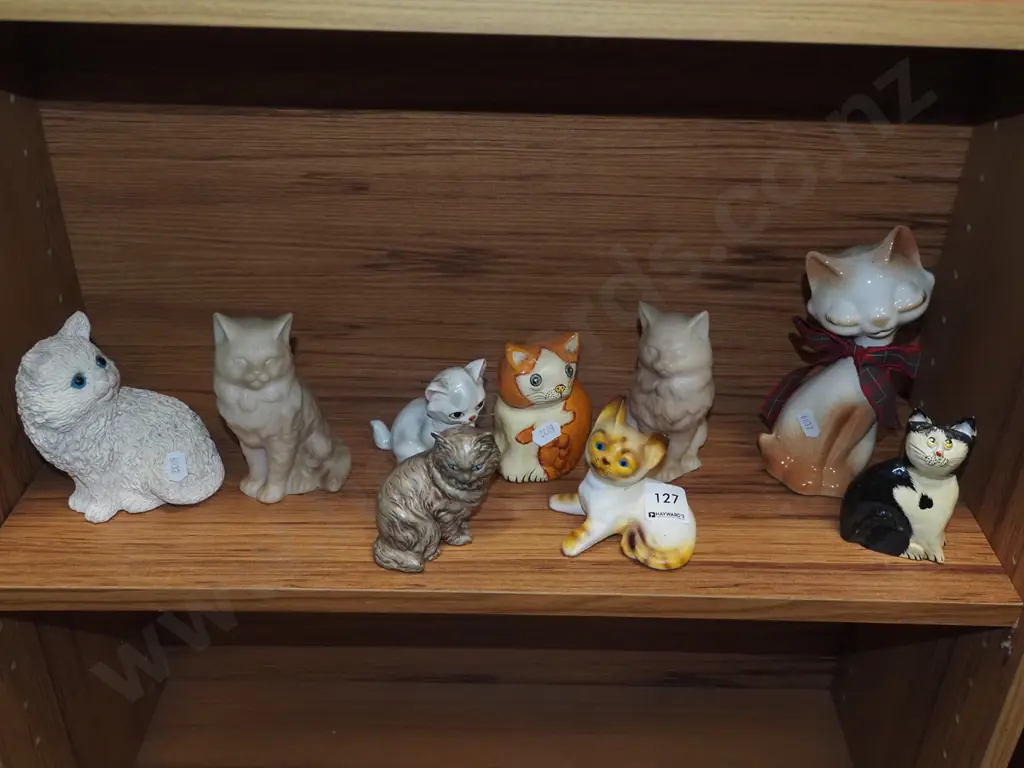 shelf of cat figurines Image 1++