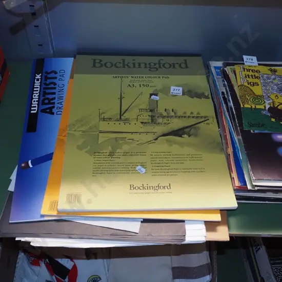 bundles of art papers and pads