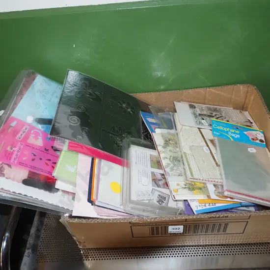 box; crafters supplies, cellophane bags,coloured paper, stencils etc