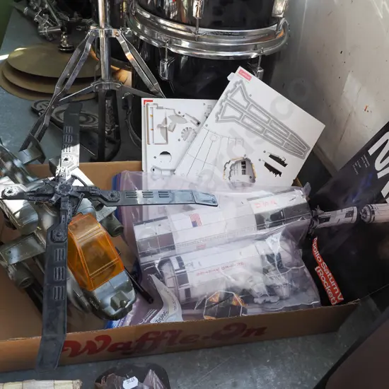 model toy helicopter, partially assembled rocket