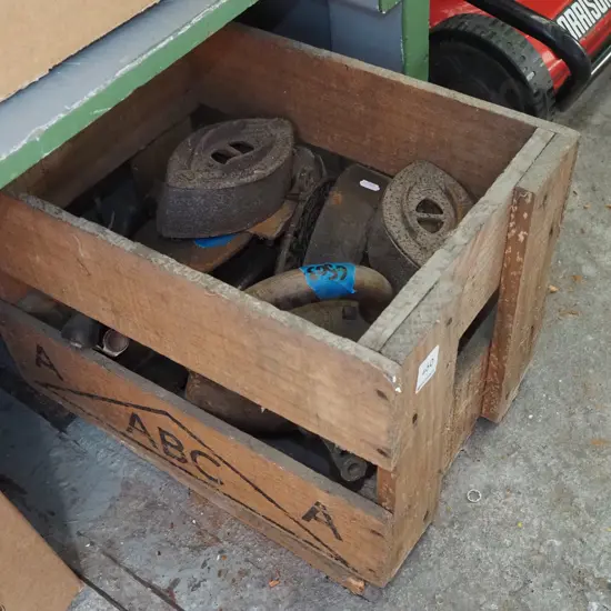 beer crate of rusty sad irons