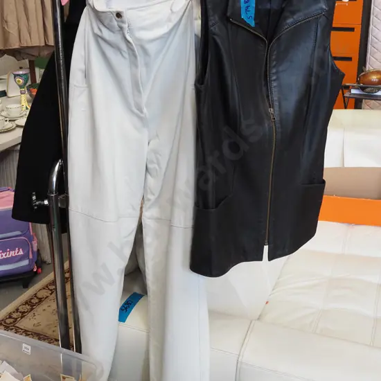 pair of white leather size 10 pants, black leather vest