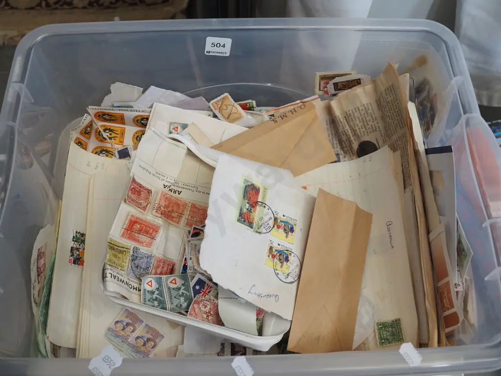 plastic tub of stamps Image 1++