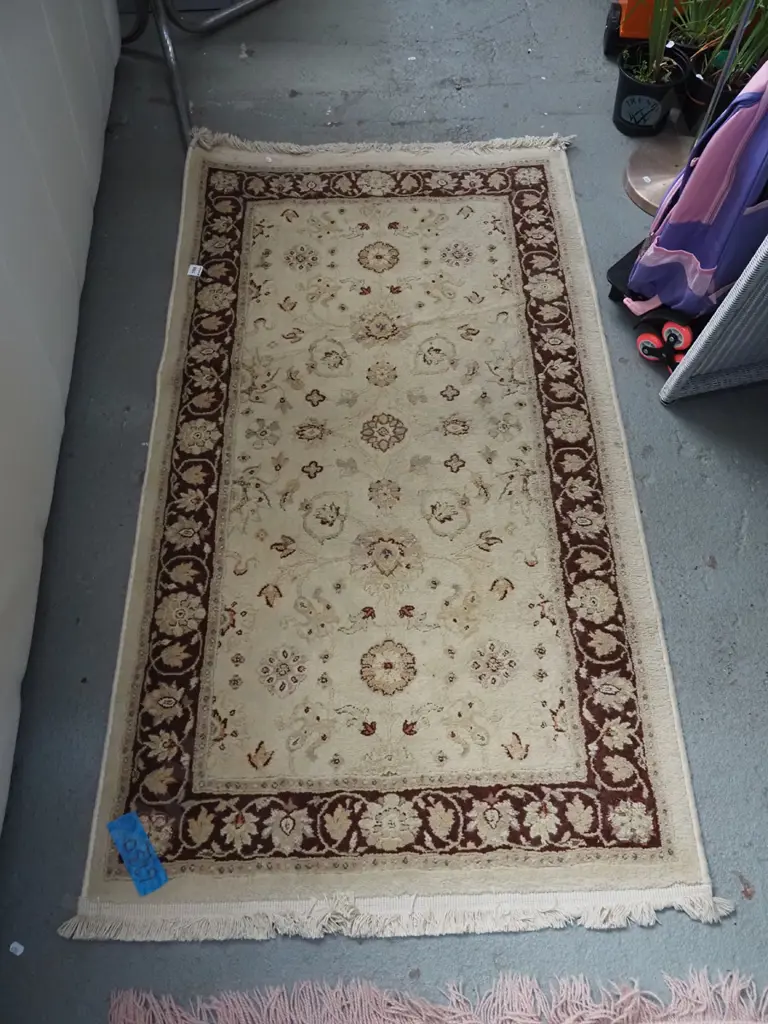 small tan and burgundy floor mat L1440 W800 Image 1++