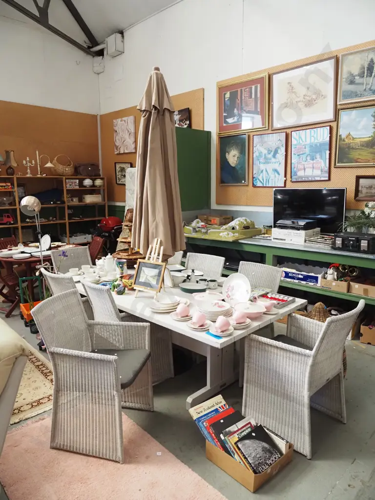 large solid wood white painted outdoor dining table with taupe sun umbrella Image 1++