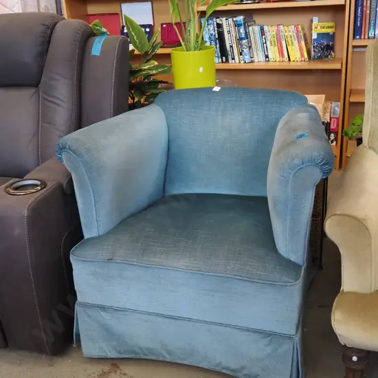 blue upholstered armchair