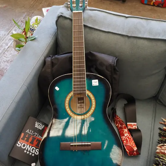 Ashton 3/4-size acoustic guitar, strap, book and soft bag