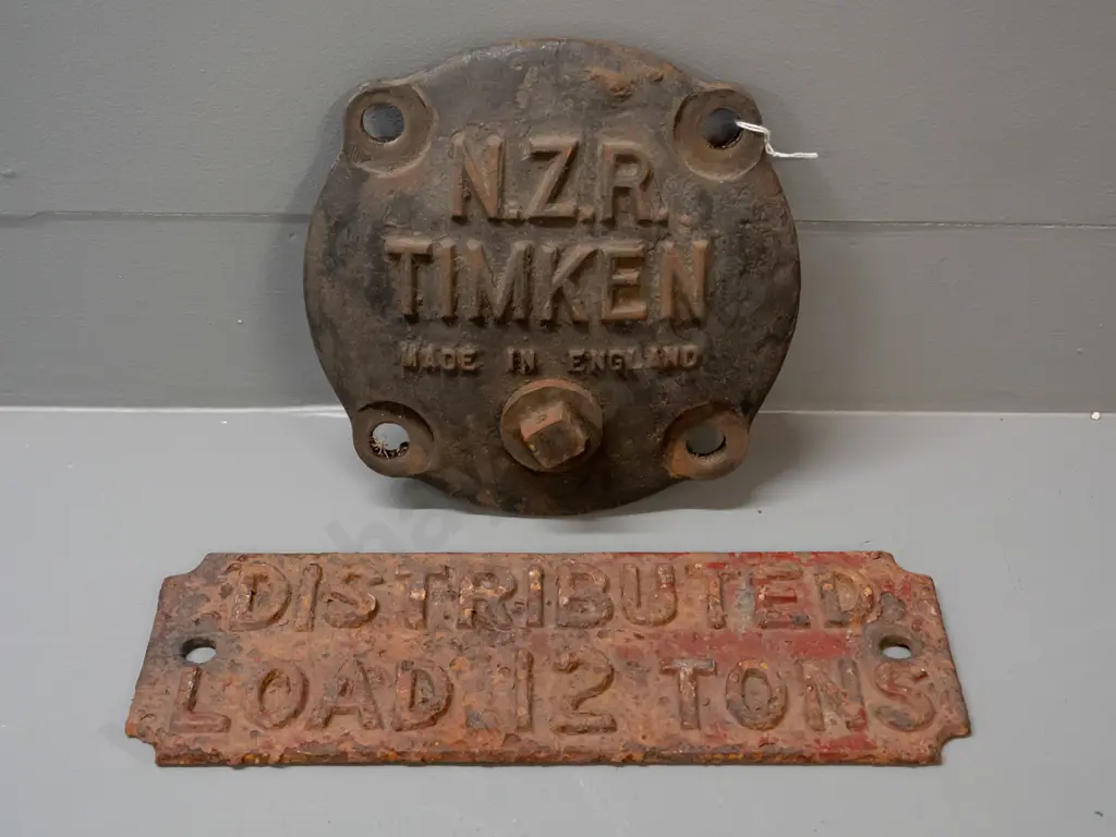 2 cast iron railway items - NZR Timken axle box cover plate and a corroded "Distributed Load 12 Tons" sign. Axle cover Image 1++