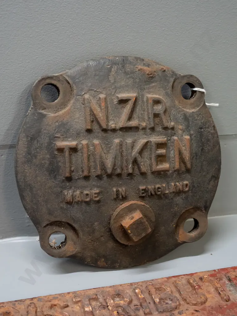 2 cast iron railway items - NZR Timken axle box cover plate and a corroded "Distributed Load 12 Tons" sign. Axle cover Image 1++