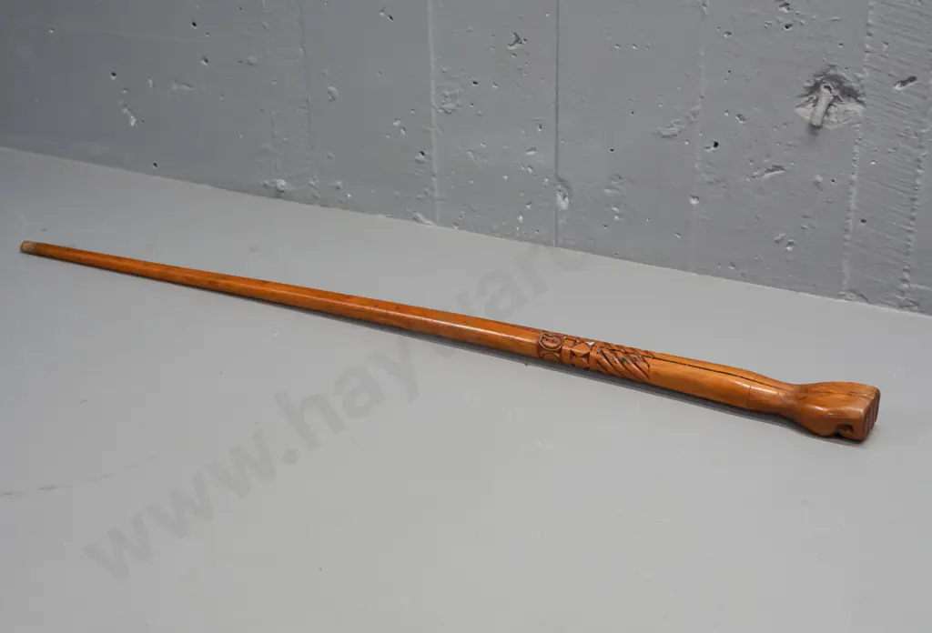 carved wood walking stick with clenched fist handle, Pacific island style motifs, missing ferrule, split thru centre Image 1++