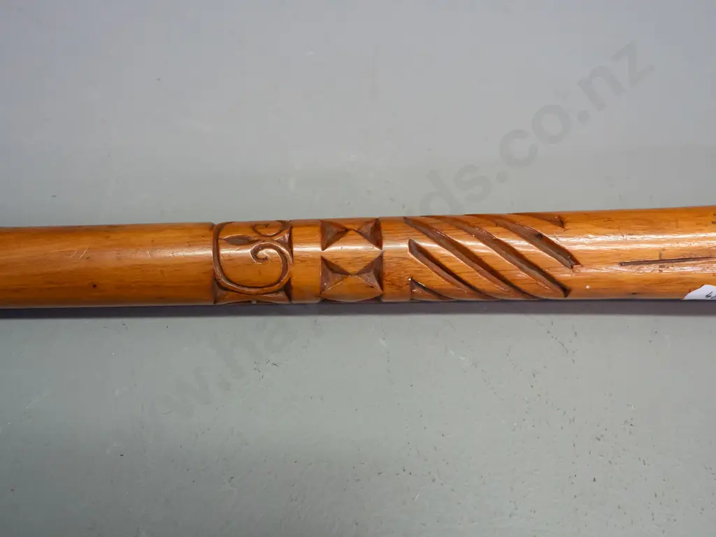 carved wood walking stick with clenched fist handle, Pacific island style motifs, missing ferrule, split thru centre Image 1++