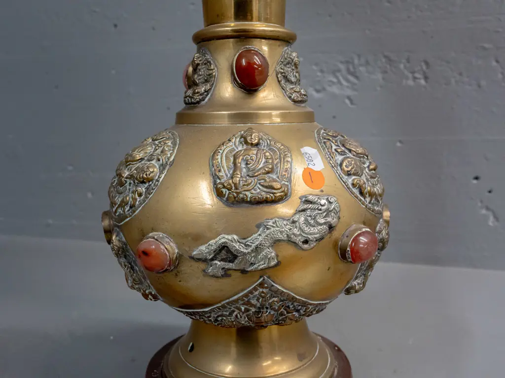 brass table lamp with applied Buddha and mythical beast decoration and inset stone or glass cabuchons - 3 are missing. Image 1++