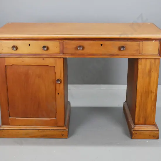 1890s kauri small desk with pedestal cupboard, 3 drawers, alterations to right side with pedestal covered over, filled