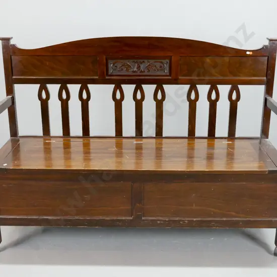 nouveau style New Zealand kauri settle with beech panels, carved back above shaped slats, open arm sides, lift-up