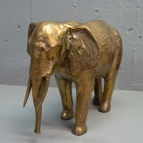 large hollow cast brass elephant - minor age wear and discolouration H-250 L-335