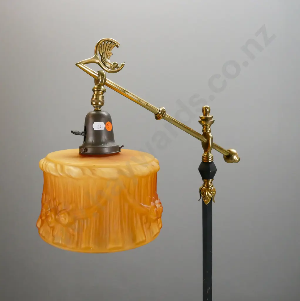 retro brass standard lamp with black painted column and fluted base, angled top bar with bird motif, small amber glass Image 1++