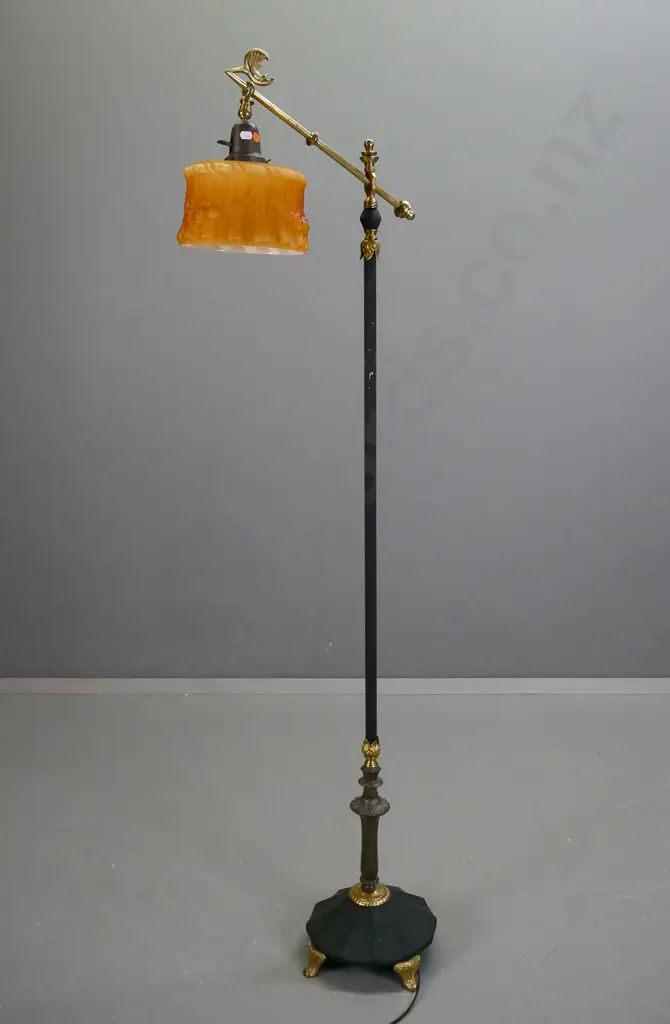 retro brass standard lamp with black painted column and fluted base, angled top bar with bird motif, small amber glass Image 1++