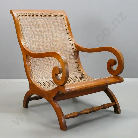 vintage large teak and hand woven cane lounge chair with scrolling arms, turned rails, one arm loose. H-920 W-610 D-720