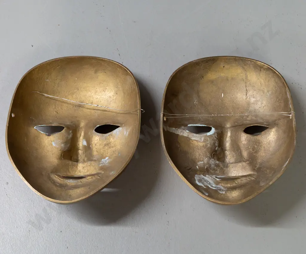 pair of cast brass ornamental wall masks. Hanging wire on one mask is broken. H-170 W-135 Image 1++