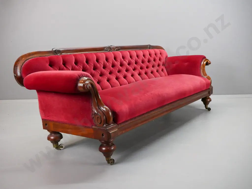 Victorian mahogany rolled-arm settee with timber framed back, carved foliate decoration, fluted arms, turned feet with Image 1++