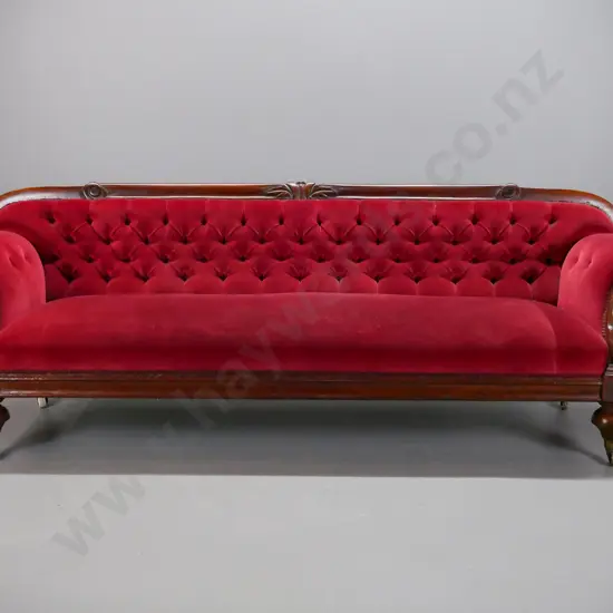 Victorian mahogany rolled-arm settee with timber framed back, carved foliate decoration, fluted arms, turned feet with