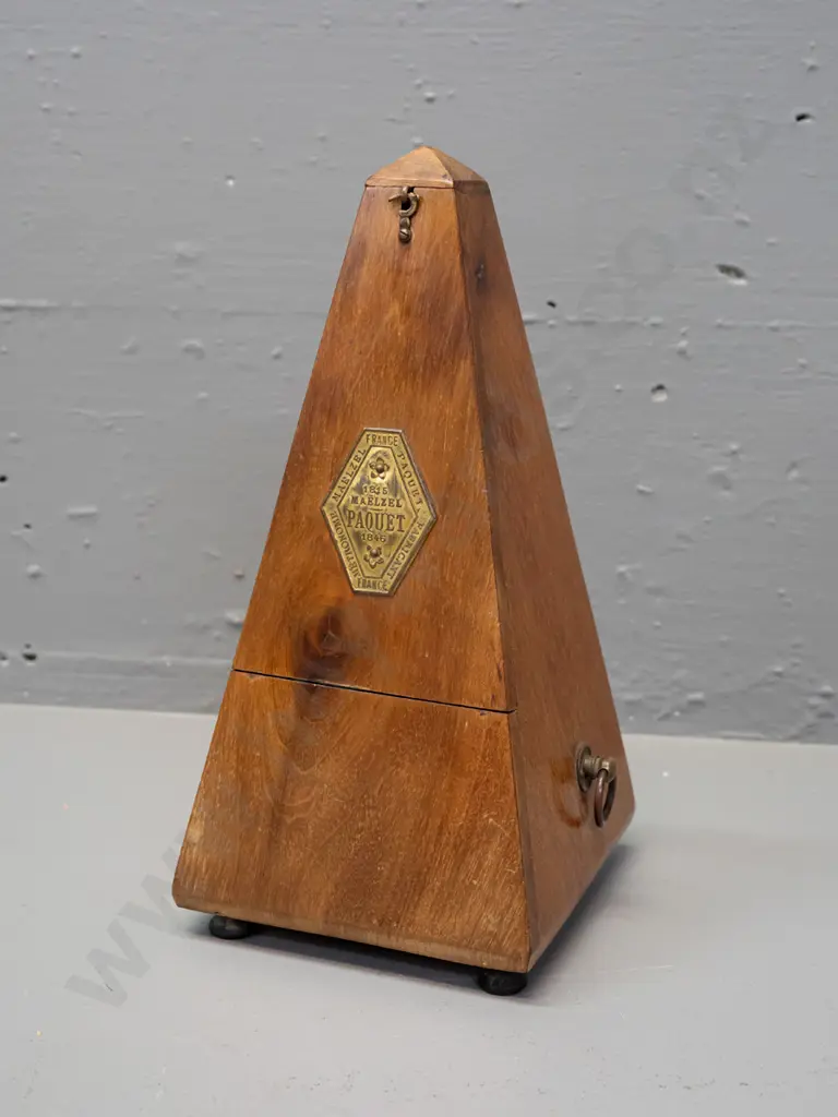 vintage timber-cased metronome Maelzel Paquet France. Working. Some fading and staining to timber, minor crack to case. Image 1++