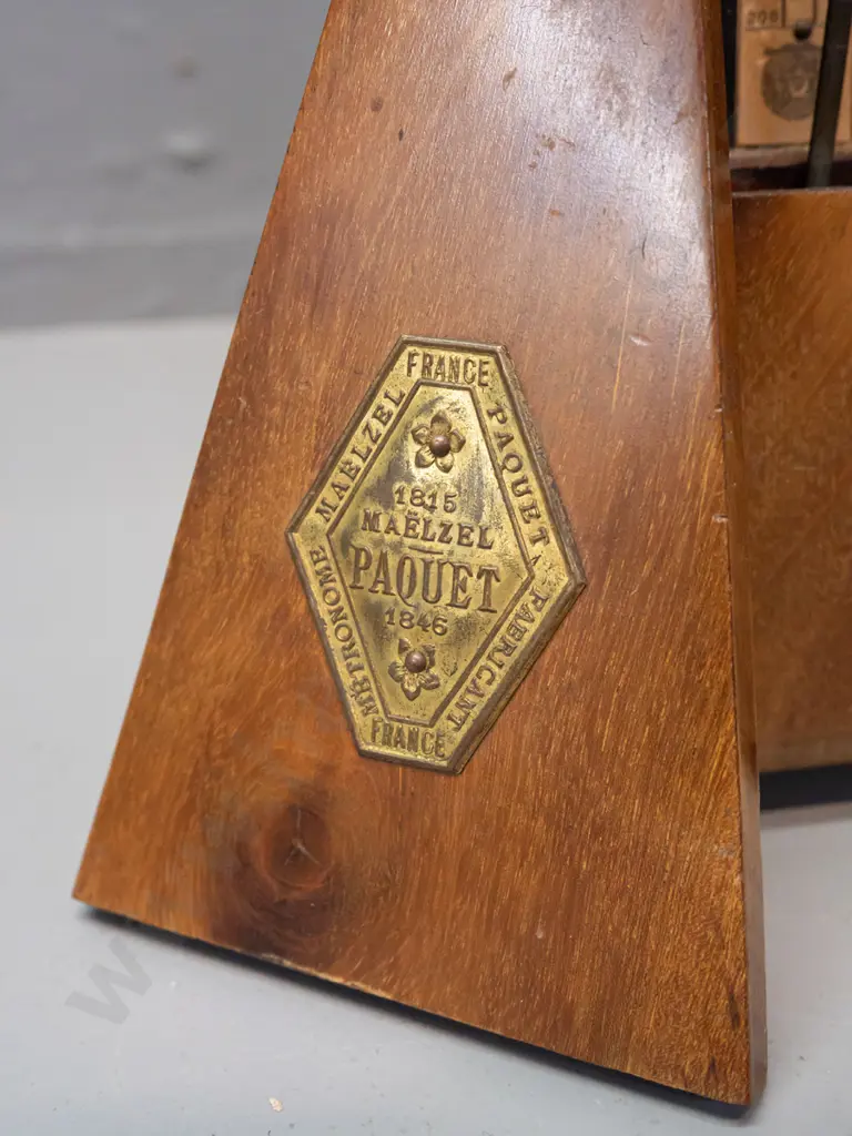 vintage timber-cased metronome Maelzel Paquet France. Working. Some fading and staining to timber, minor crack to case. Image 1++