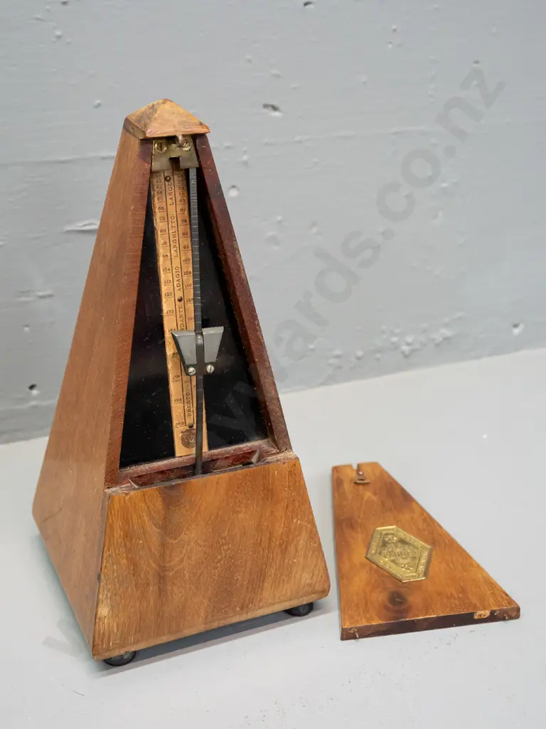 vintage timber-cased metronome Maelzel Paquet France. Working. Some fading and staining to timber, minor crack to case. Image 1++